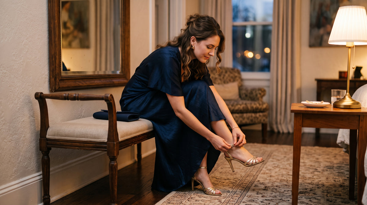 Woman putting on a high heel shoe