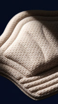 Close-up texture of KANEEA beige heel grip liner pad – soft breathable anti-blister fabric