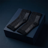 KANEEA black toeless compression ankle sleeves on navy box